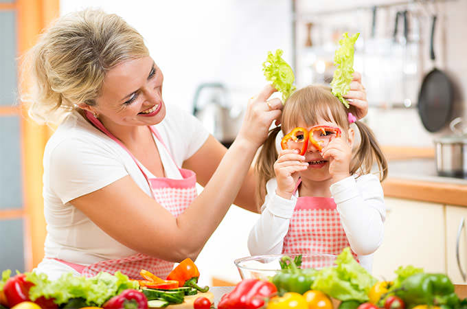 bigstock-Mother-And-Kid-Cooking-And-Hav-60604709