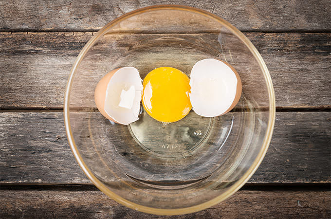 bigstock-Cracked-Chicken-Egg-With-Yolk--88454111