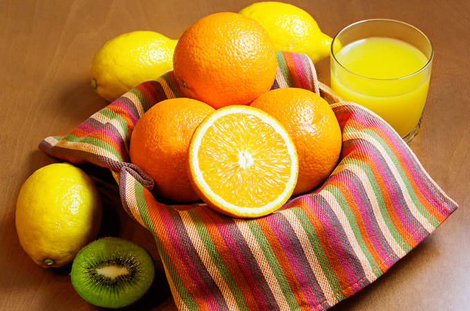 bigstock-Oranges-Lemons-Kiwi-And-Gla-93947903