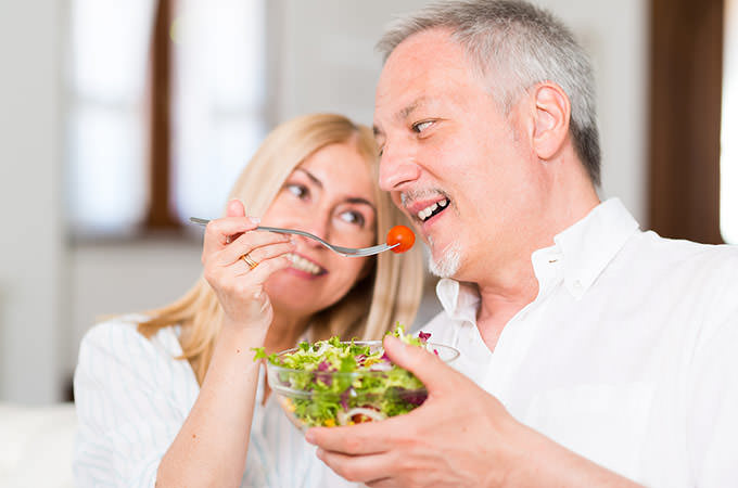 bigstock-Mature-couple-eating-a-salad-i-94099700