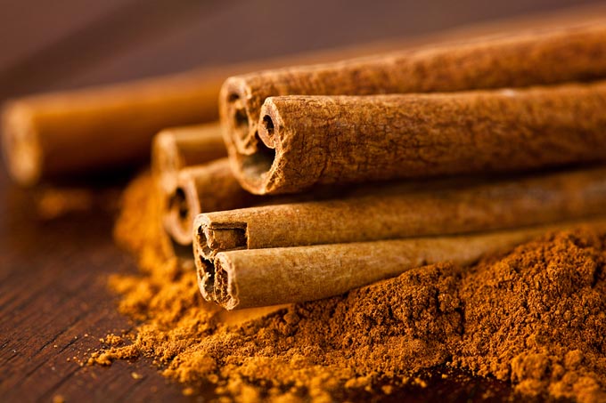 bigstock-Ground-cinnamon-and-cinnamon-s-18925820_mini