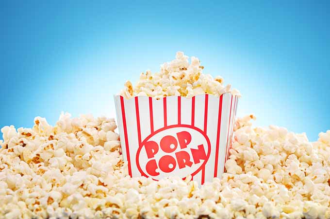 bigstock-Popcorn-in-classic-box-overflo-50177669