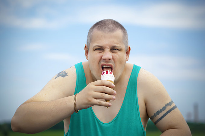 Angry man with ice cream in the hands of