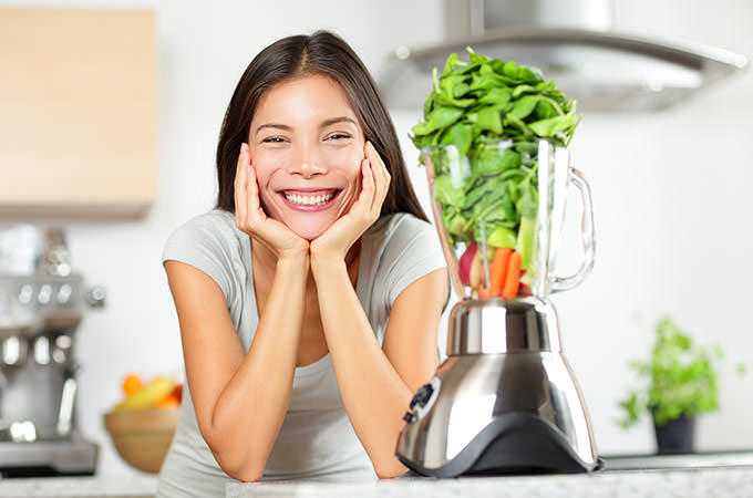 bigstock-Green-smoothie-woman-making-ve-59090819