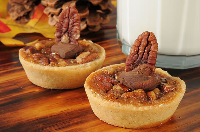 bigstock-Pecan-Tarts-With-A-Glass-Of-Mi-52712641