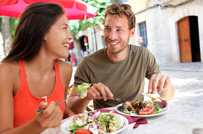 bigstock-Restaurant-tourists-couple-eat-82639652