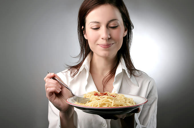 bigstock-a-young-woman-with-a-plate-of--12144779