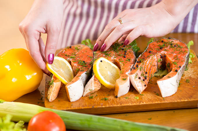 bigstock-Female-hands-close-up-cooking--90628352