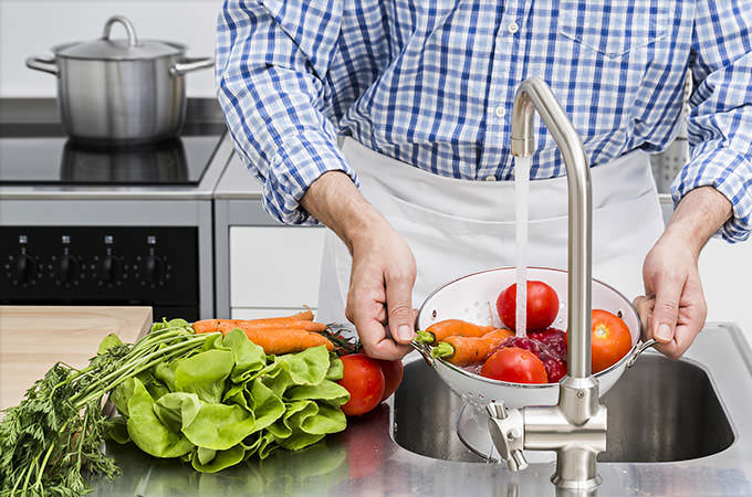 bigstock-Washing-Vegetables-In-Kitchen-88042019