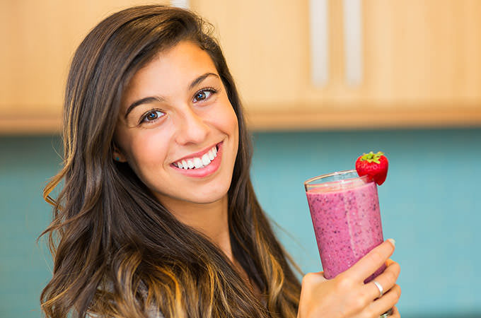 bigstock-Woman-Drinking-Fresh-Fruit-Smo-51850249