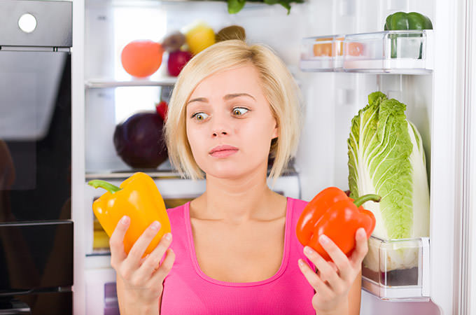 bigstock-girl-unhappy-look-red-pepper--65921974