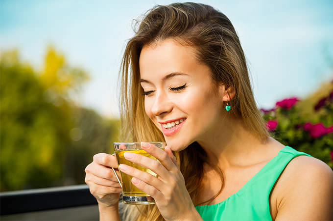 bigstock-Happy-Woman-Drinking-Green-Tea-88819931(1)