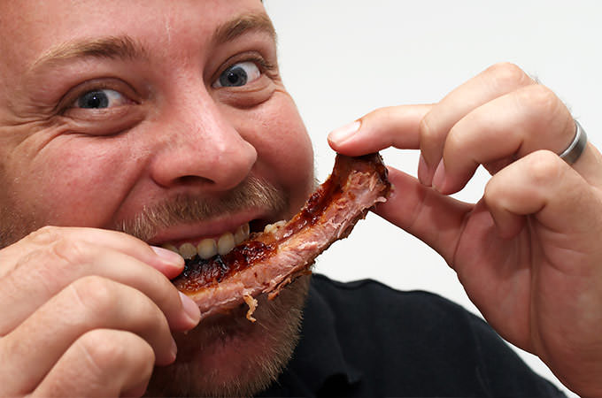 bigstock-Hungry-Man-Eating-A-Rib--1350971