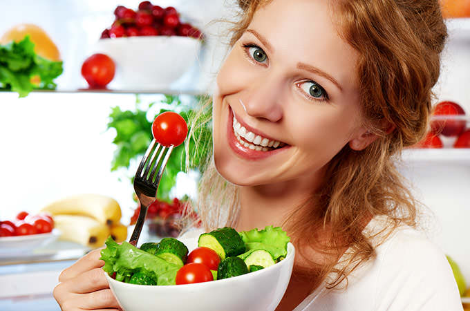 bigstock-Woman-Eats-Healthy-Food-Vegeta-94139600