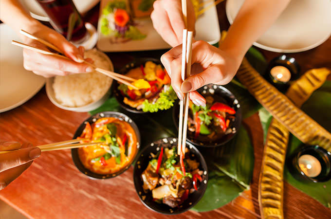 bigstock-Young-people-eating-in-a-Thai--34884905