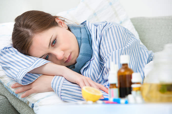 bigstock-Sick-Woman-Lying-In-Bed-52148785