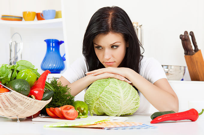 bigstock-young-woman-in-kitchen-31513754