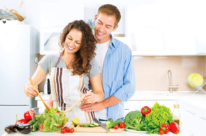 bigstock-Happy-Couple-Cooking-Together--73071298