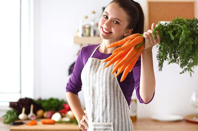 bigstock-Happy-young-woman-holding-bunc-97966571