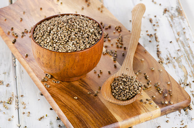 bigstock-Hemp-Seeds-On-Wooden-Board--104747201