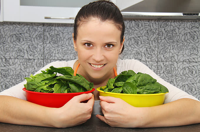 bigstock-Woman-with-a-spinach-in-a-mode-73963711