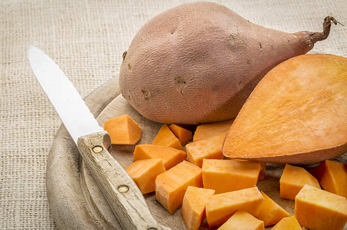 bigstock-sweet-potato-cut-and-diced-on--82374476