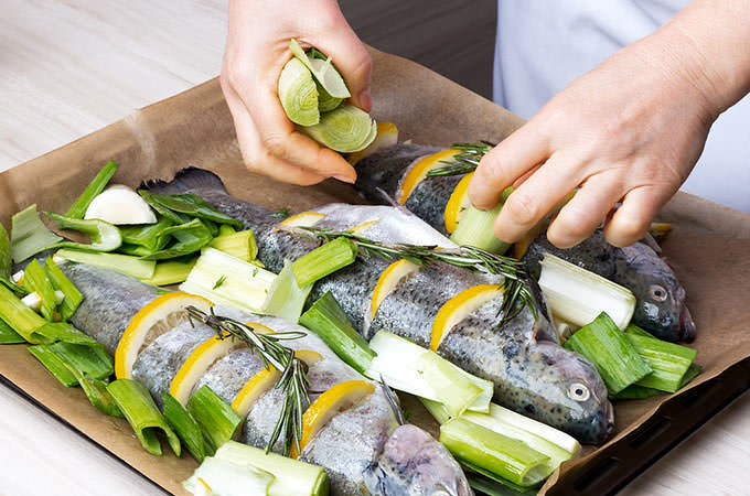 bigstock-Cooking-trout-fish-with-lemon--84860864