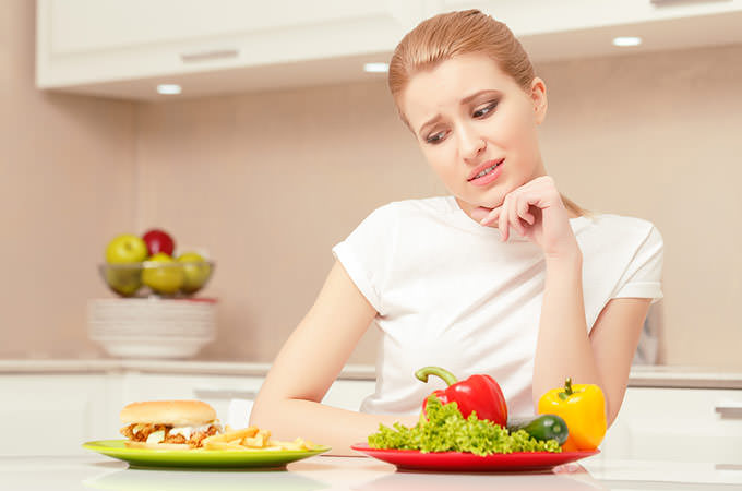 bigstock-Young-woman-choosing-lunch-88961201