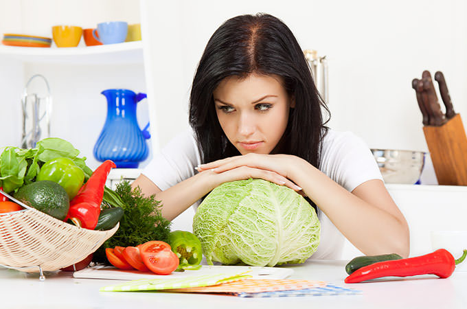 bigstock-young-woman-in-kitchen-31513754
