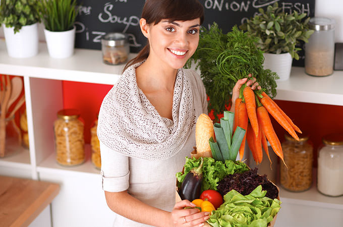 bigstock-happy-young-woman-holding-bunc-101104541