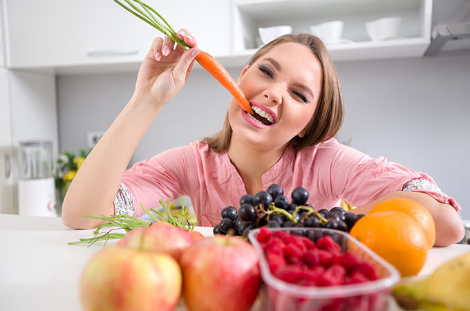 bigstock-funny-girl-biting-a-carrot-sh-77163977